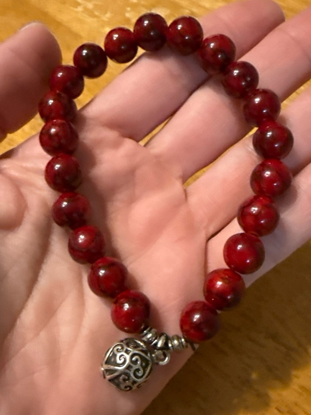 Hand Crafted Red Beaded Bracelet with Silver Filigree Charm